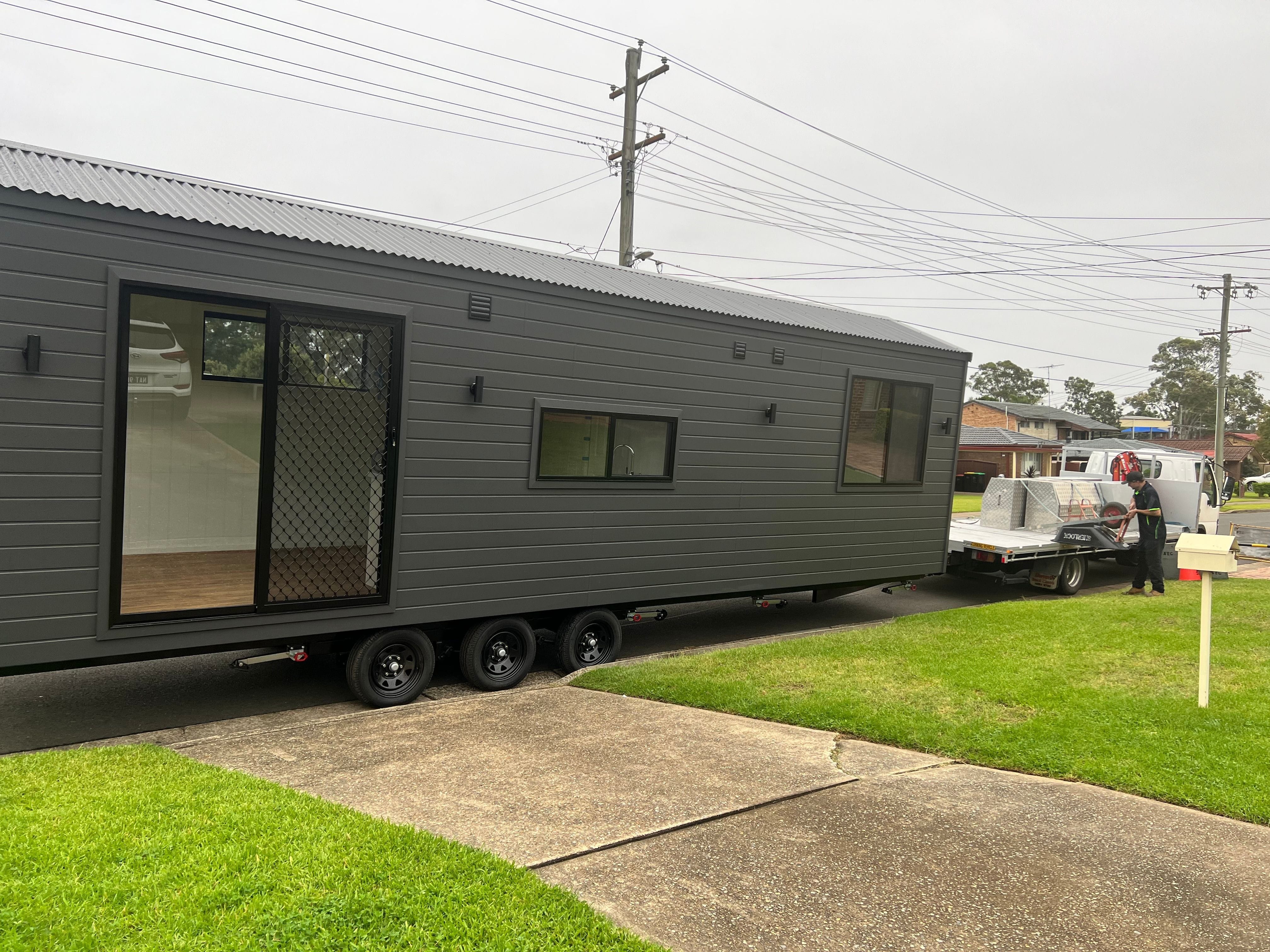 The Tiny Grandeur tiny house on wheels, delivered kerbside ready to be positioned.