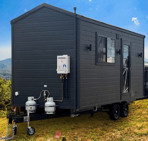 "Tiny Haven: A charming tiny home on wheels designed for comfort and tranquility, perfect for a cosy getaway."