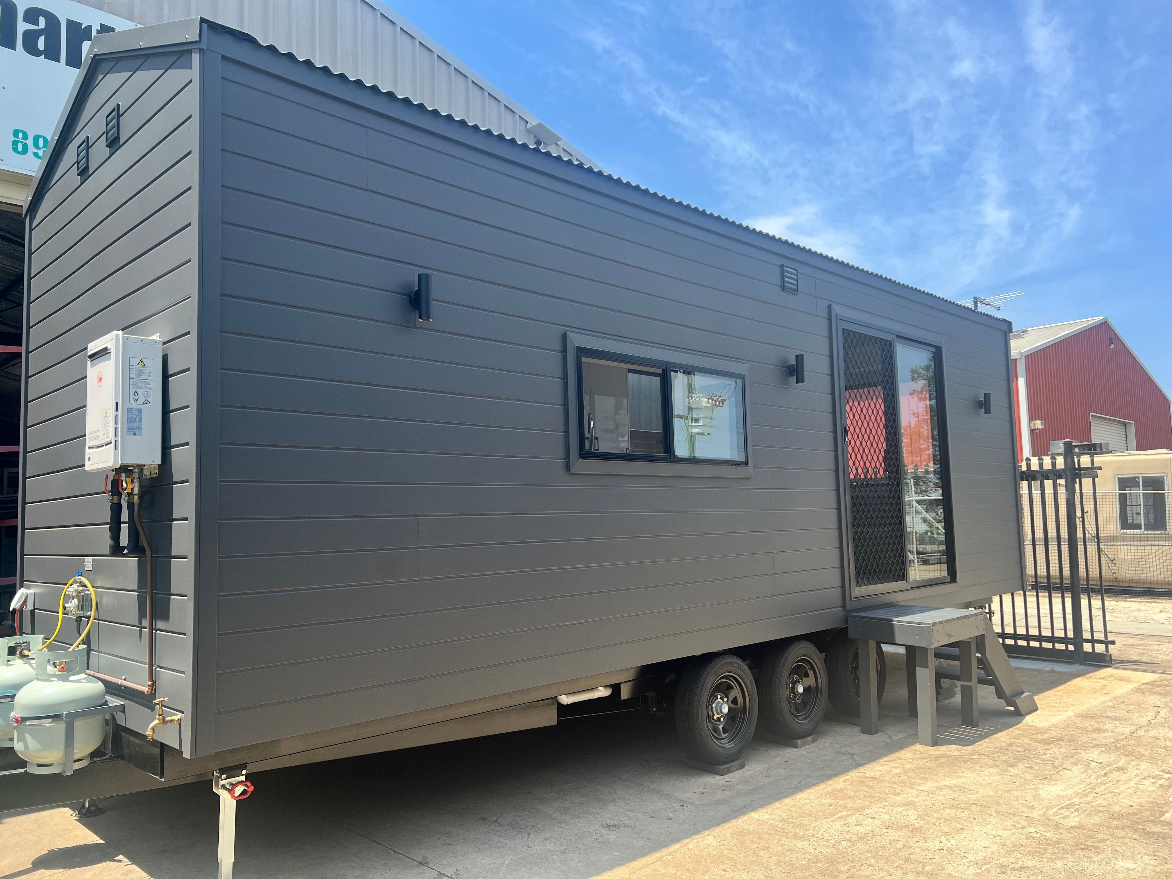 Exterior view of the Tiny Voyager tiny house on wheels ready for inspection